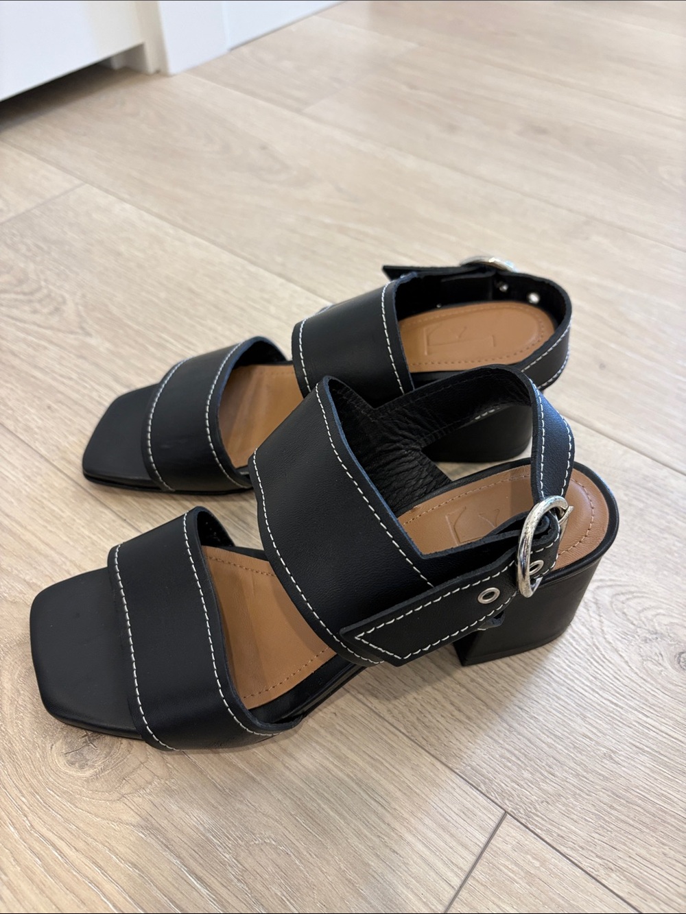 Flattered Black Block Heel Sandals with White Stitching